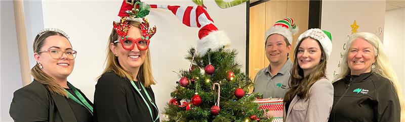 Spirit Super team near Christmas tree
