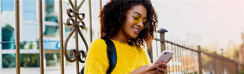 Happy woman with mobile phone