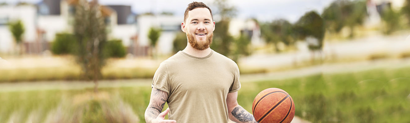 Young member holding basketball